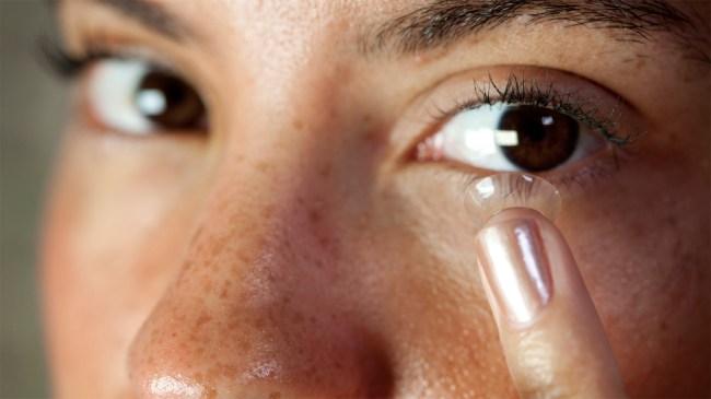 person-inserting-contact-lens-into-eye