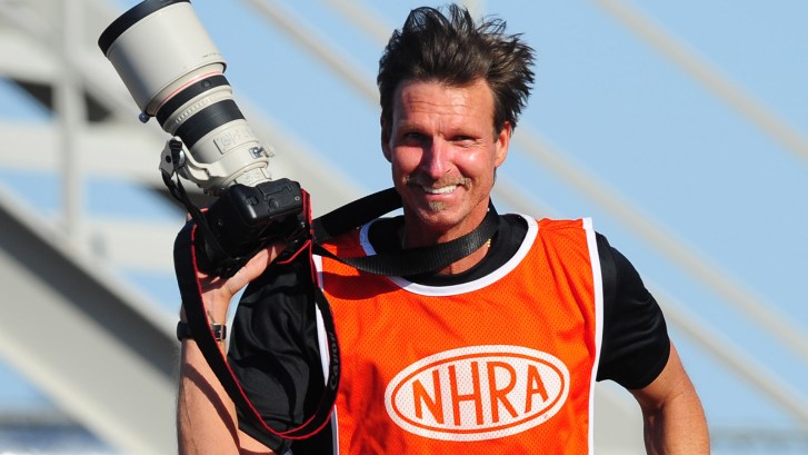 Randy Johnson taking photos at NHRA race
