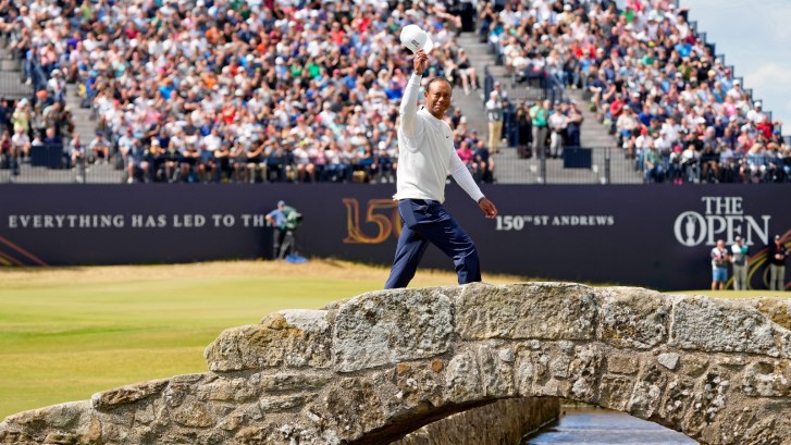 Tiger Woods crossing the bridge at St. Andrews during the Open Championship