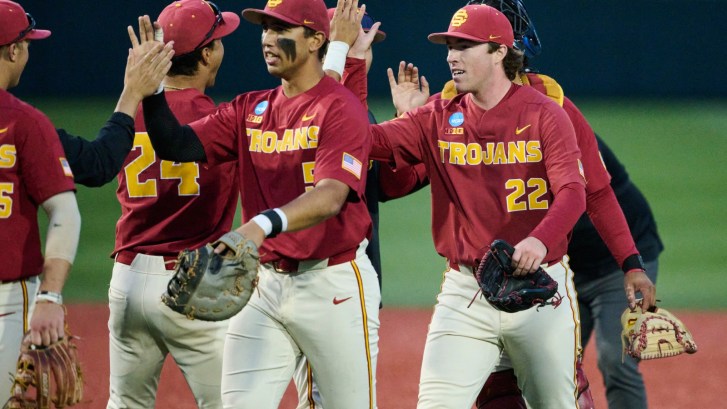 USC baseball players celebrate after a win
