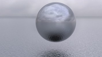 Another Unexplained Metallic Orb-Shaped UFO Was Filmed Flying And Hovering In The Sky