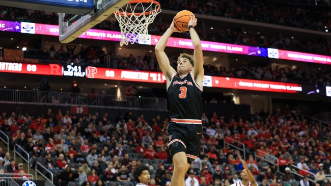 Princeton's Caden Pierce dunks the basketball