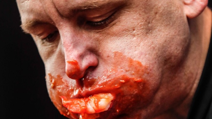Joey Chestnut eating cocktail shrimp