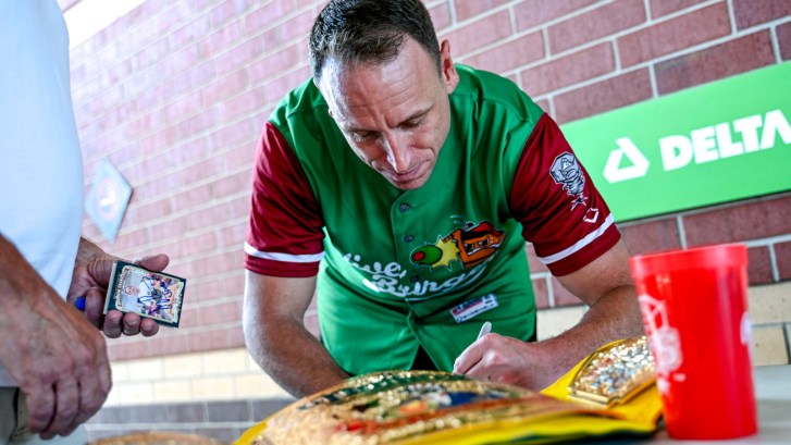 Joey Chestnut signing autographs