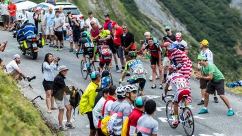 Tour De France Spectator Flipped By Support Car During Awkward Collision Proves People Are Idiots