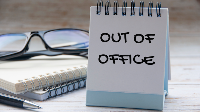 vacation-out-of-office-text-on-white-notepad