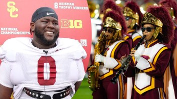 USC’s Monstrous D-Lineman Shows Two Extremes Of The Human Physique By Dwarfing Flautist In Marching Band